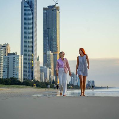 Two women walking on the beach on the Gold Coast