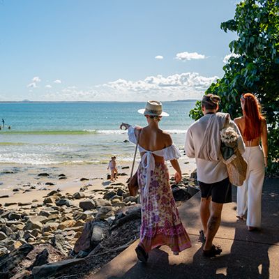 Three people on the coast, beach Noosa