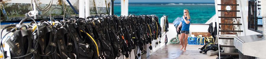 Lineup of scuba diving equipment on Reef Encounter