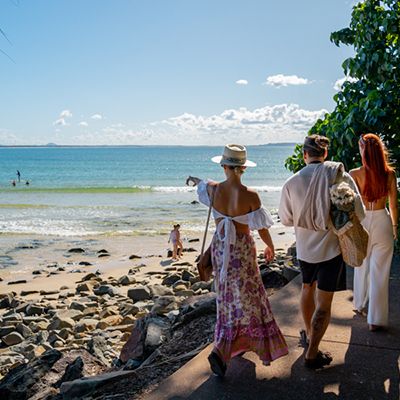 Group of people walking to the beach in Noosa