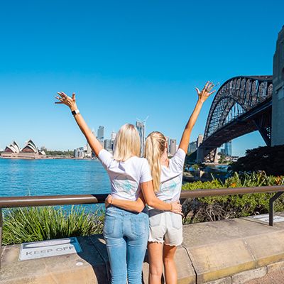Two people in front of the Sydney Opera House