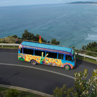 The Happy Coach driving along Byron Bay Coastline
