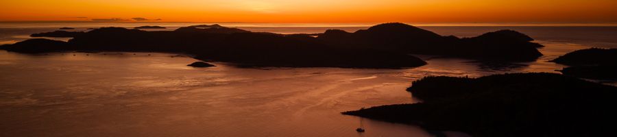 orange sunset over the whitsunday islands