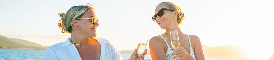 two women with champagne on a superyacht