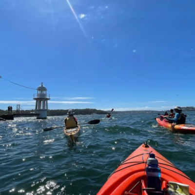 First person view sitting in kayak on Sydney Harbour