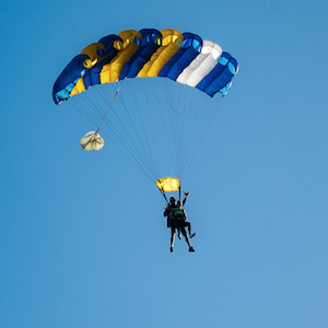 Tandem skydivers gliding through the sky