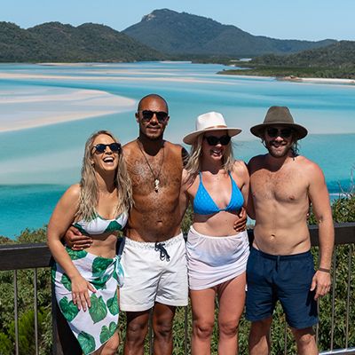 group posing in front of Hill Inlet Lookout