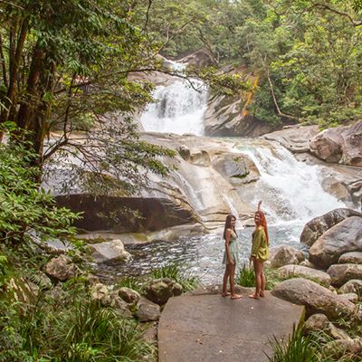 girls standing in front of Josephine Falls