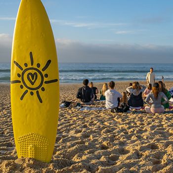 Byron Bay surf lesson with a yellow board and small group