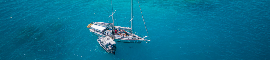 Aerial view of Ocean Free sailing boat on the Great Barrier Reef