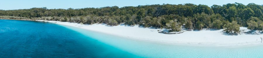 blue water and white sand at Lake McKenzie