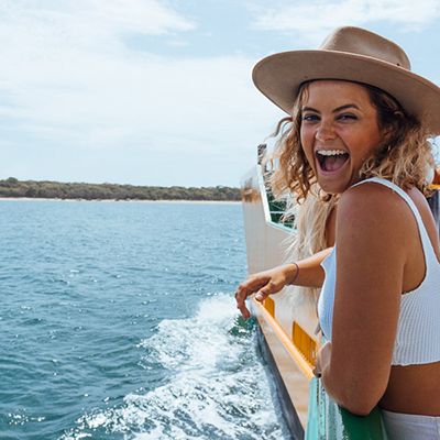 girl smiling on a ferry ride from Brisbane