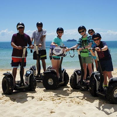 travelers joining a segway tour on the beach at Moreton Island