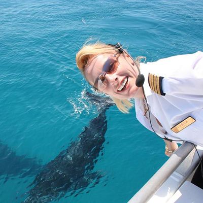 whale watching captain smiling onboard in Moreton Bay