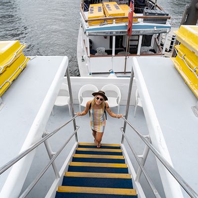 girl boarding the Mirimar River Cruise in Brisbane