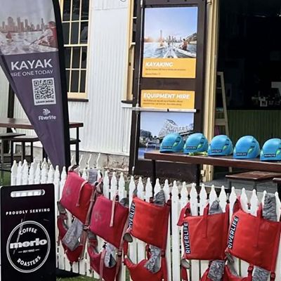 kayak store with signs and helmets in brisbane