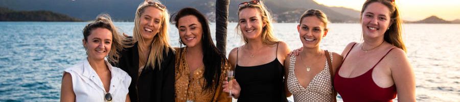 girls smiling on a sunset cruise in the whitsundays