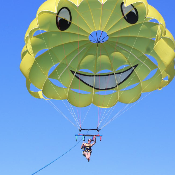 A girl in the air parasailing