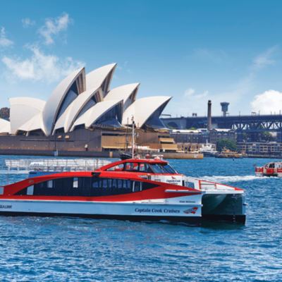 Captain Cook Cruises red ferry with Opera House in background