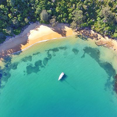aerial view of tour boat in secluded sydney bay