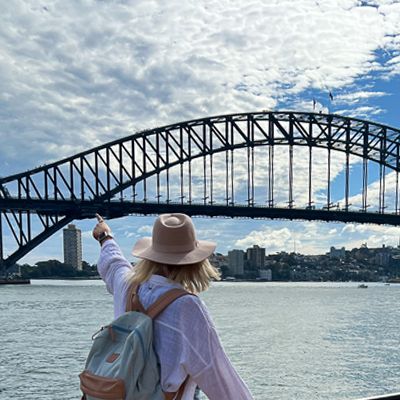 girl looking at the sydney harbour bridge on a cruise