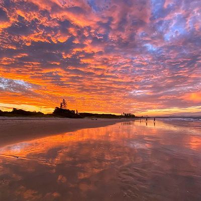 Byron Bay Beach at sunrise with electric orange tones