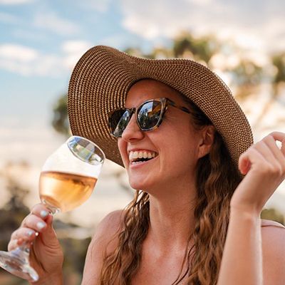girl drinking a glass of wine at a wine tasting