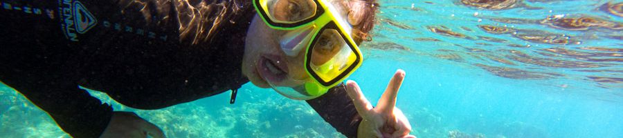 girl snorkelling in the great barrier reef