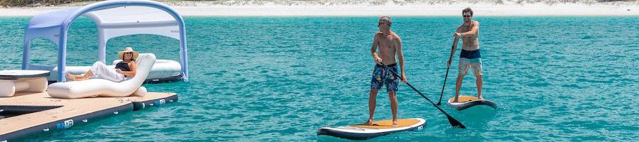 travelers using water sports equipment on superyacht charter