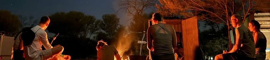 people gathered at outback campsite near uluru