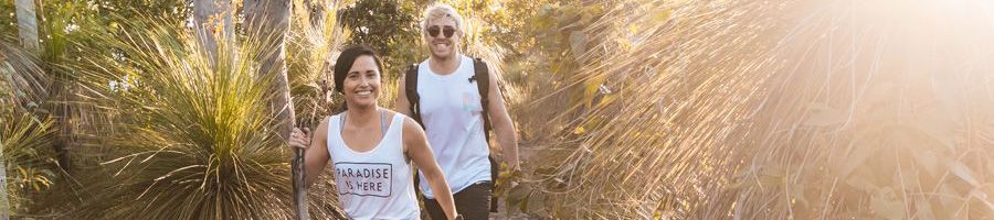 couple hiking through the wilderness in australia