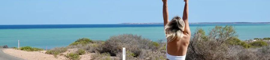 A woman on the West Coast by the beach