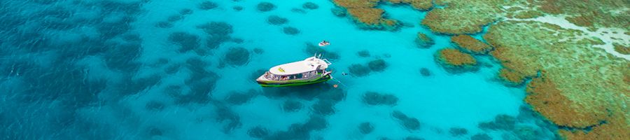 viper boat moored next to the outer great barrier reef