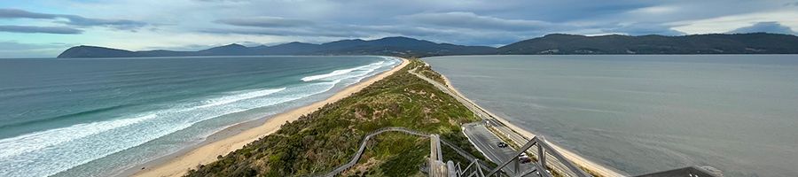 The Neck Lookout at Bruny Island with blue sea, stone and greenery