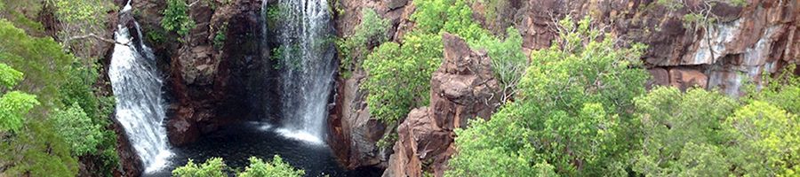 waterfalls tumbling down rugged cliffs in litchfield national park australia