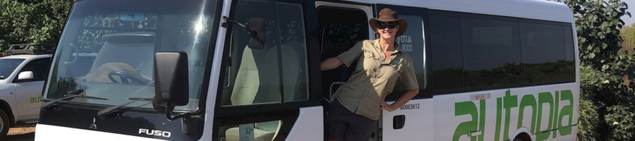 Autopia Bus with Driver Standing in Doorway