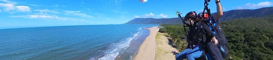 tandem paragliders flying over wangetti beach queensland