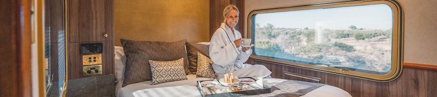 lady having breakfast in a premium cabin on the ghan