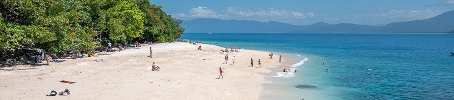 nudey beach with white sand and blue water fitzroy island