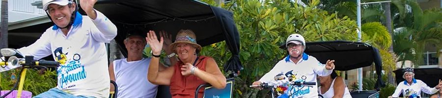 A group of people on tuk tuks