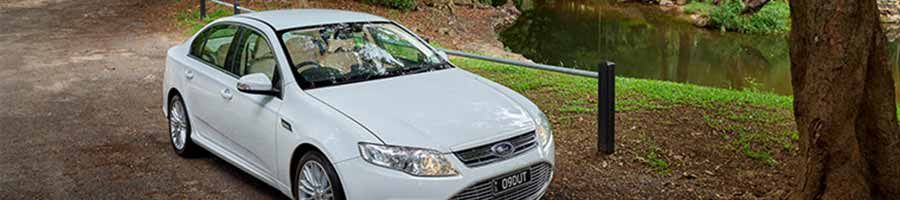 private tour vehicle parked in the daintree rainforest