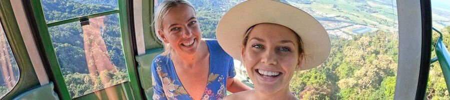 Two women on the Skyrail Cableway over the rainforest to Kuranda