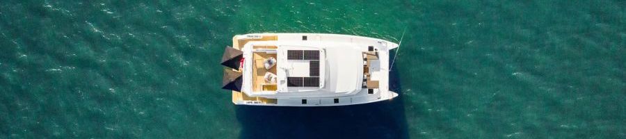 aerial view of ginger luxury yacht on the turquoise ocean