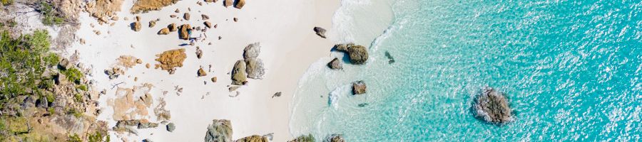 Whitehaven Beach, Betty's Bay, from above with blue waters, rocks and sands