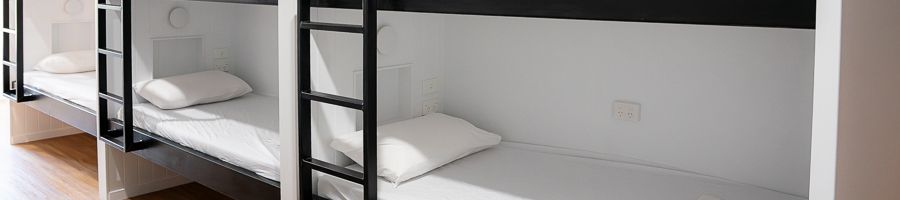 dorm beds with white linen at bounce airlie