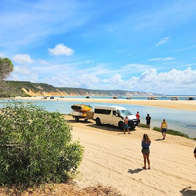 van and surfers hanging out at double island point