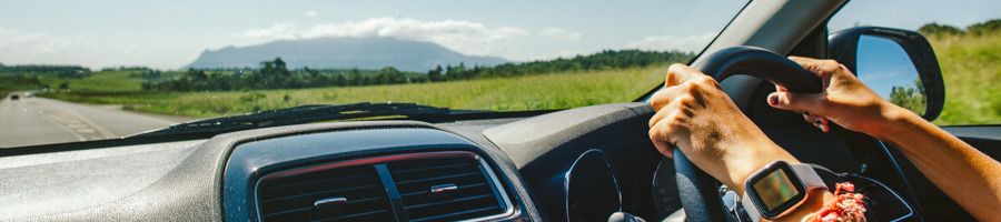 A backpacker driving a 4WD vehicle