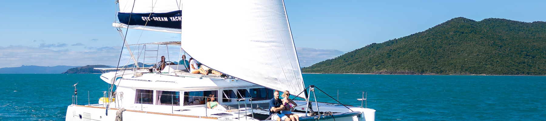 A catamaran sailing through the ocean