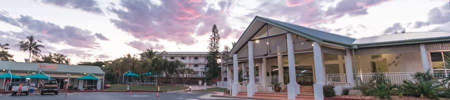 kgari beach resort entrance with sunset clouds