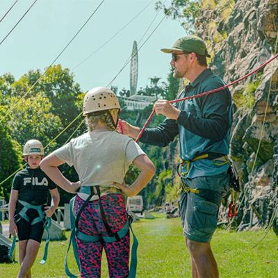 instructor explaining rock climbing equipment